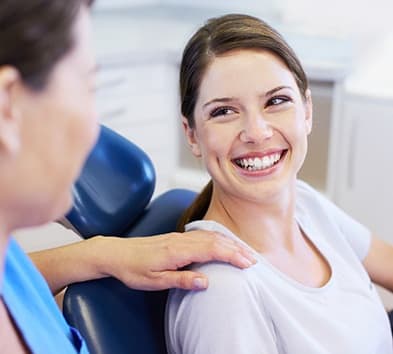 Smiling woman in dental chair