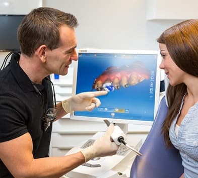 dentist showing a patient their digital impressions