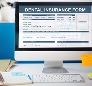 Dental insurance form displayed on computer monitor