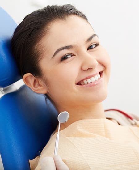 Smiling woman in dental chair