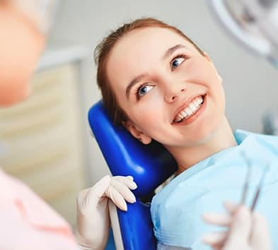 Smiling woman in dental chair