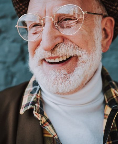 Fashionable man smiling with dentures