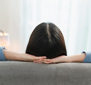 Woman resting at home on a couch