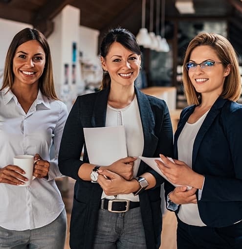 Three smiling business women