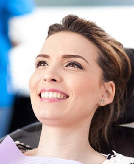 woman smiling in the dental chair 