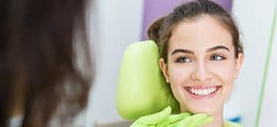 Smiling woman in dental chair