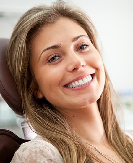 Smiling woman in dental chair