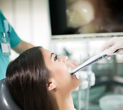 Dentist capturing intraoral images