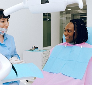 Woman speaking with dentist