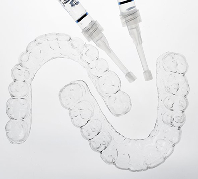 at-home teeth whitening trays and bleaching gel 
