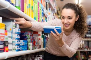 patient shopping for teeth whitening toothpastes