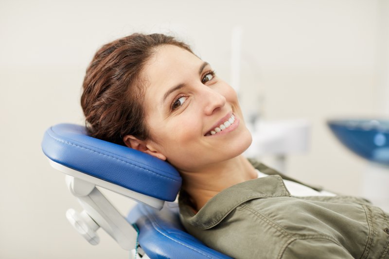 young woman sitting in dental chair